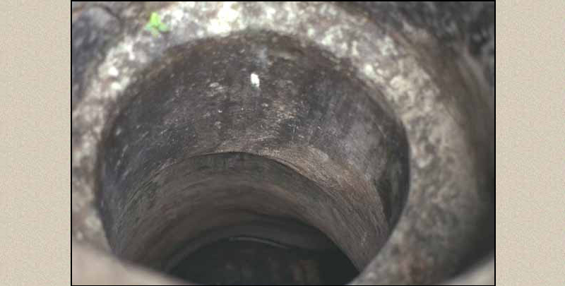Chicanná, view of the mouth of a chultun showing the interior lined with stucco