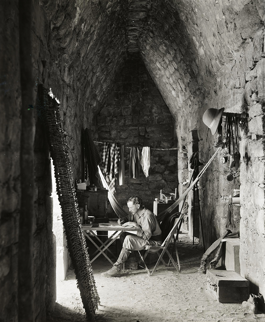 Alfred Maudslay working in a chamber of Las Monjas at Chichén Itzá in 1889