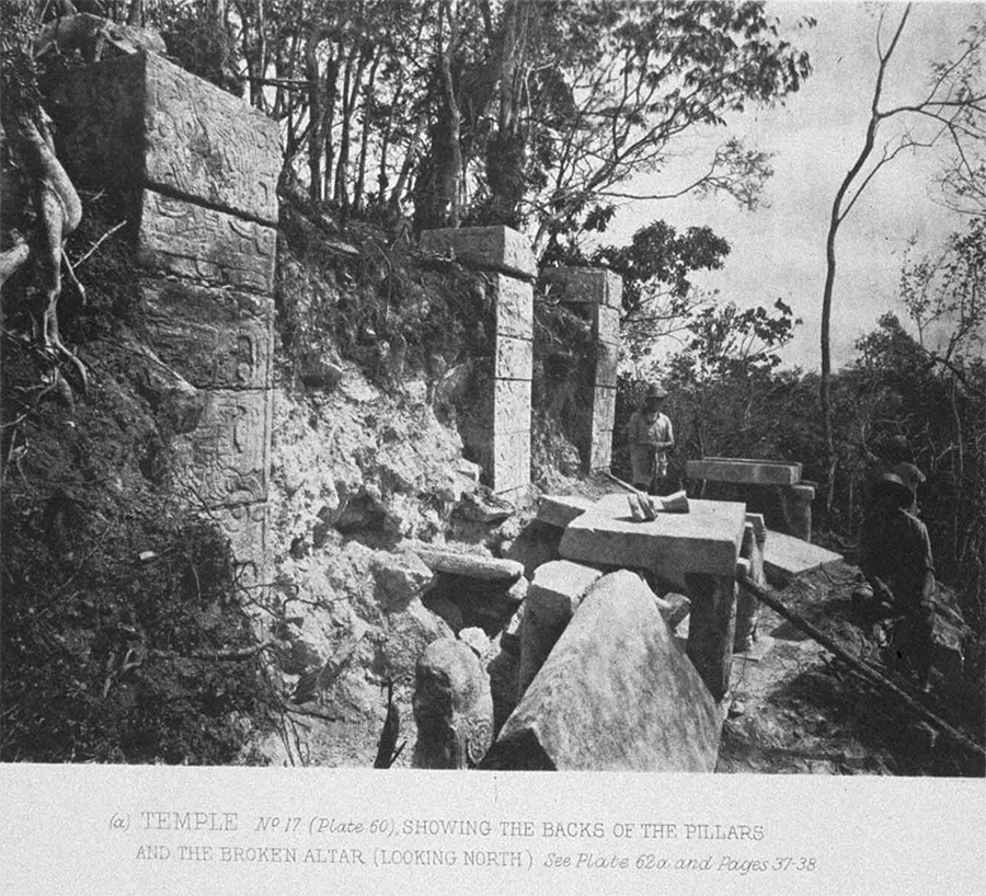 Maudslay's 1889 photo of the top of the Temple of the Tables, showing the tables supported by Atlantean figures and three square columns with the rubble and vegitation choaking them