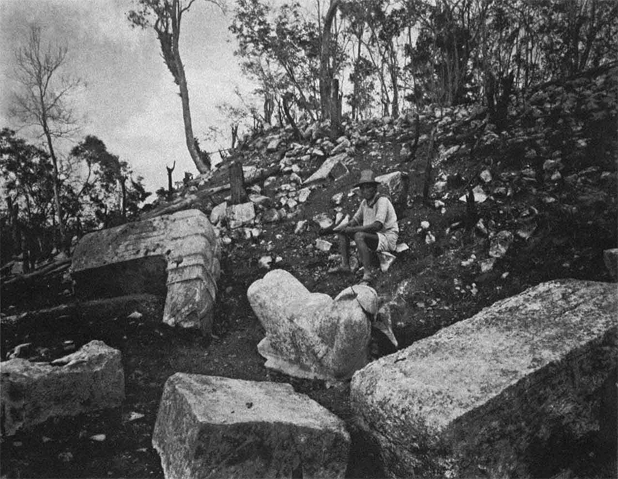 Maudslay's 1889 photo of the ruinous state of Temple of the Warriors, with serpent tails and headless Chac Mools strewn over the pyramid base