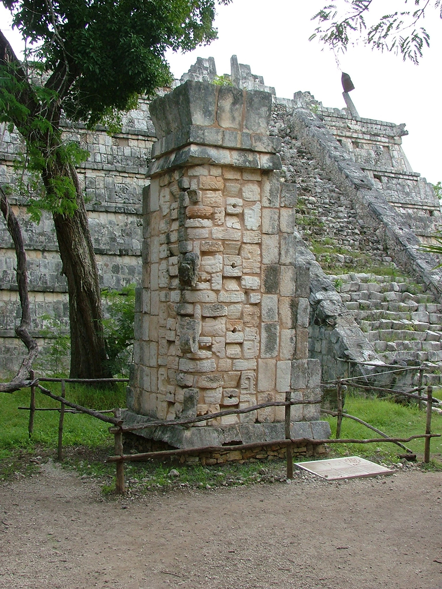 2004 photo of the Puuc style Chaak mask stacks that once formed the corner of the Ossuary Temple, now reassembled in front of the pyramid