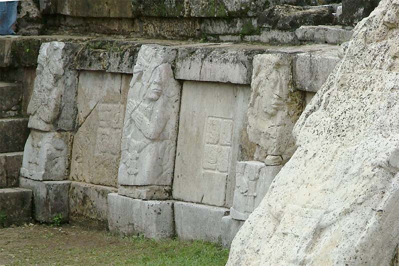 Three of the six figures flanking the hieroglyphic stair to House C